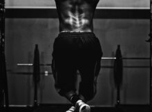 grayscale photo of man working out